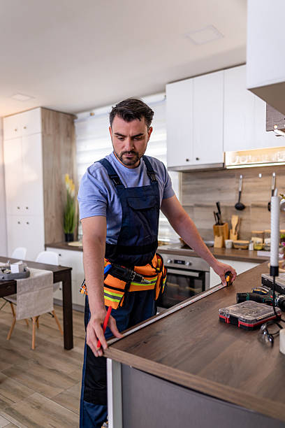 Craftsman building custom cabinetry in a modern workshop